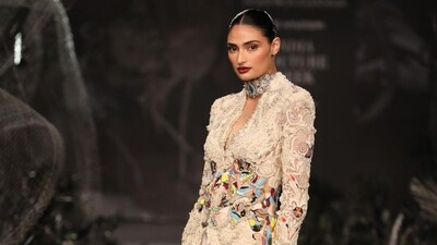 Anamika Khanna presented her collection on Day 6. Actor Athiya Shetty, who walked the runway as a showstopper for the designer, said it was an honour for her to walk for Anamika, who had also designed her champagne pink lehenga for her wedding with Indian cricketer KL Rahul in January. Anamika Khanna presented her collection on Day 6. Actor Athiya Shetty, who walked the runway as a showstopper for the designer, said it was an honour for her to walk for Anamika, who had also designed her champagne pink lehenga for her wedding with Indian cricketer KL Rahul in January. 