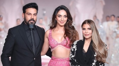 Kiara Advani turned showstopper for the opening show by designer duo Falguni and Shane Peacock, and walked the ramp in a pink Barbie-inspired look with bead and sequin work. The dress featured a top with plunging neckline and a skirt with a high slit and long train at the back. Many on social media called Kiara 'desi Barbie'. Kiara Advani turned showstopper for the opening show by designer duo Falguni and Shane Peacock, and walked the ramp in a pink Barbie-inspired look with bead and sequin work. The dress featured a top with plunging neckline and a skirt with a high slit and long train at the back. Many on social media called Kiara 'desi Barbie'.