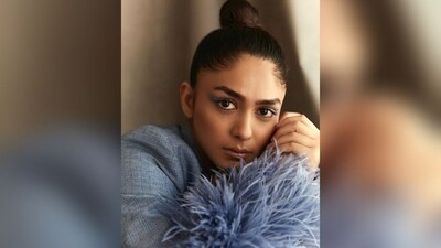 With the assistance of celebrity hairstylist Surekha Nivate, Mrunal styled her tresses into a neat high bun that perfectly complemented her boss babe look. (Instagram/@mrunalthakur) With the assistance of celebrity hairstylist Surekha Nivate, Mrunal styled her tresses into a neat high bun that perfectly complemented her boss babe look. (Instagram/@mrunalthakur)