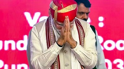 Prime Minister Narendra Modi gestures while being conferred with Lokmanya Tilak National Award, in Pune on Tuesday. 