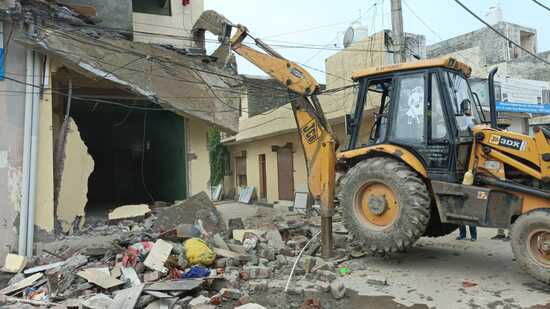 Demolition drive underway at Pabhat village that falls under the Zirakpur MC. (HT Photo)