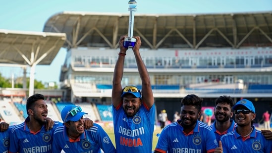 Mukesh Kumar lifts the trophy after India defeated West Indies by 200 runs in the third ODI (AP)