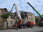 Rescuers clear debris after a drone hit an educational establishment, in Kharkiv, on August 1, 2023, amid the Russian invasion of Ukraine. Rescuers clear debris after a drone hit an educational establishment, in Kharkiv, on August 1, 2023, amid the Russian invasion of Ukraine.