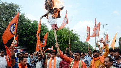Members of Bajrang Dal burn an effigy during a protest against the violence in Haryana's Nuh district, at GTB Nagar in East Delhi in New Delhi (PTI) Members of Bajrang Dal burn an effigy during a protest against the violence in Haryana's Nuh district, at GTB Nagar in East Delhi in New Delhi (PTI)