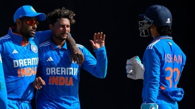 Kuldeep Yadav (2nd R) and Suryakumar Yadav (L) of India celebrate the dismissal of Alick Athanaze of the West Indies during the 3rd and final ODI (AFP)