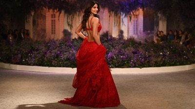 Vaani Kapoor walked the ramp wearing a red chikankari embroidered contemporary lehenga paired with a matching sleeveless blouse featuring a plunging neckline. (AFP) Vaani Kapoor walked the ramp wearing a red chikankari embroidered contemporary lehenga paired with a matching sleeveless blouse featuring a plunging neckline. (AFP)