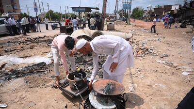 People retrieving their belongings after violence in Sohna. (PTI) People retrieving their belongings after violence in Sohna. (PTI)