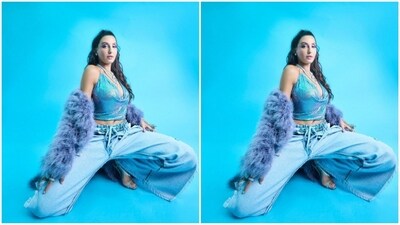 With the assistance of celebrity fashion stylist Maneka Harisinghani, Nora accessorised her look with trendy jewellery, opting for multi-layered silver chain necklaces, rings on her fingers, a silver jewelled glove in one hand and a pair of silver strappy heels. (Instagram/@norafatehi) With the assistance of celebrity fashion stylist Maneka Harisinghani, Nora accessorised her look with trendy jewellery, opting for multi-layered silver chain necklaces, rings on her fingers, a silver jewelled glove in one hand and a pair of silver strappy heels. (Instagram/@norafatehi)
