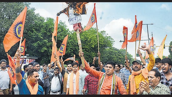 Bajrang Dal members protest in GTB Nagar in Delhi on Wednesday. (HT Photo)