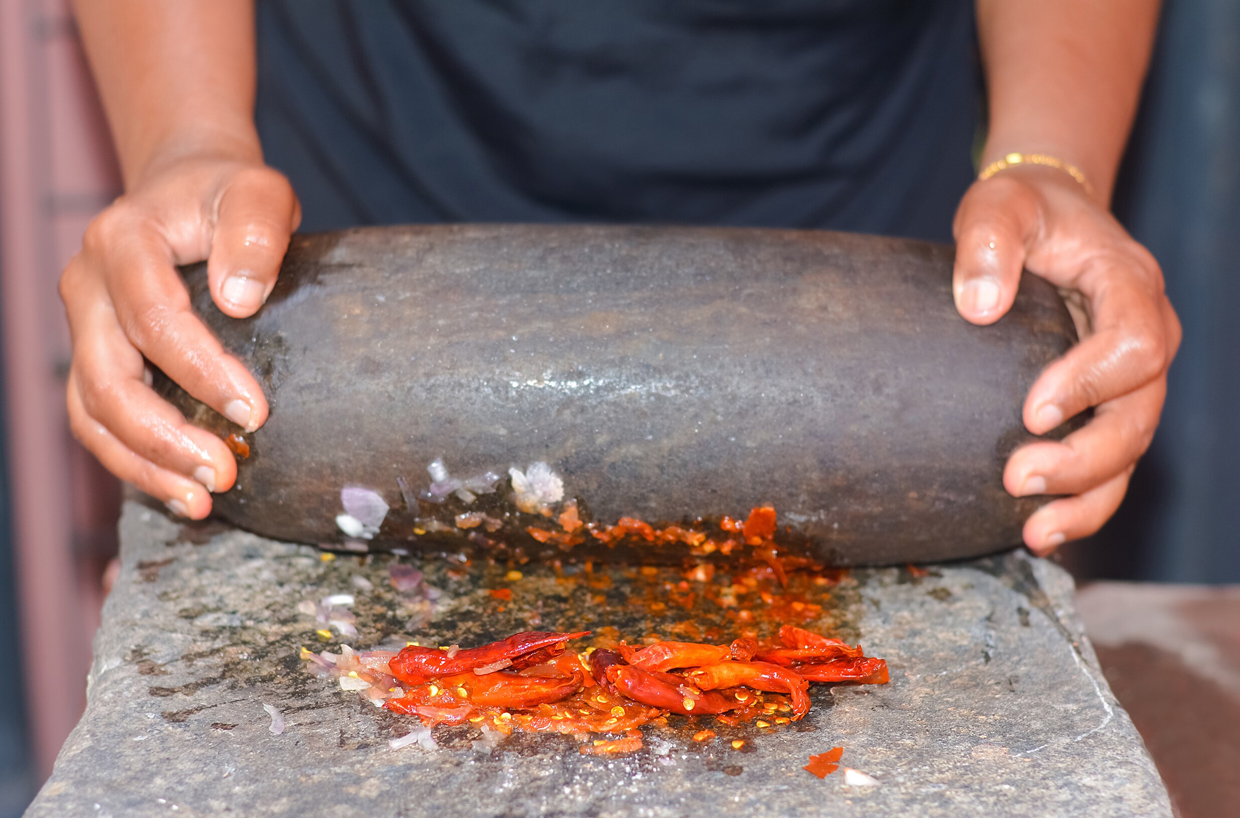 “The shil-nora grinding mustard to a paste, the sound of two stones arguing and agreeing.” (Shutterstock)