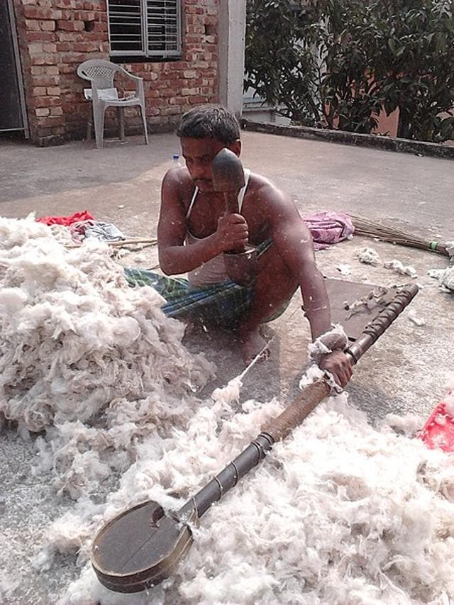 “The twang of the dhunuri on winter afternoons; the cotton carder with what we thought was his cotton-fluffing guitar.” (Wikimedia Commons)