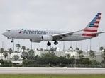 FILE - An American Airlines Boeing 737-823 lands at Miami International Airport in Miami, July 27, 2020. 