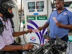 A motorcyclist makes payment using Rs. 2000 note, at a petrol pump, in Lucknow. A motorcyclist makes payment using Rs. 2000 note, at a petrol pump, in Lucknow.