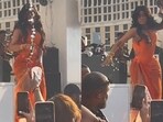 Cardi B, in orange dress on stage, during her Las Vegas show. Cardi B, in orange dress on stage, during her Las Vegas show.