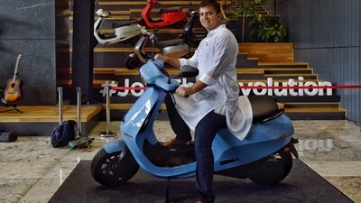 Bhavish Aggarwal, Co-founder and CEO of Ola, poses for a photograph with the new Ola electric scooter during its launch at the Ola headquarters in Bangalore on August 15, 2021. (AFP) Bhavish Aggarwal, Co-founder and CEO of Ola, poses for a photograph with the new Ola electric scooter during its launch at the Ola headquarters in Bangalore on August 15, 2021. (AFP)