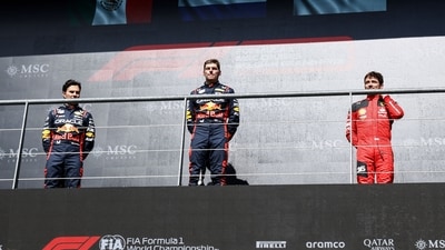 Winner Red Bull Racing's Dutch driver Max Verstappen (C), second-placed Red Bull Racing's Mexican driver Sergio Perez (L) and third-placed Ferrari's Monegasque driver Charles Leclerc (R) pose on the podium (AFP) Winner Red Bull Racing's Dutch driver Max Verstappen (C), second-placed Red Bull Racing's Mexican driver Sergio Perez (L) and third-placed Ferrari's Monegasque driver Charles Leclerc (R) pose on the podium (AFP)