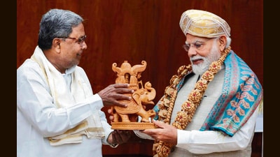 Chief minister Siddaramaiah with Prime Minister Narendra Modi, in New Delhi on Thursday. (PTI) Chief minister Siddaramaiah with Prime Minister Narendra Modi, in New Delhi on Thursday. (PTI)