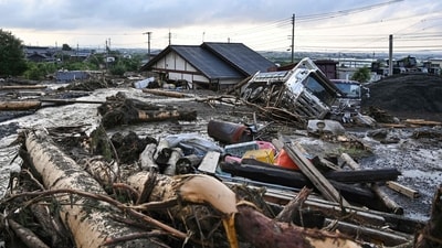 Japan: Debris from flooding sits in the road in the city of Kurume, Fukuoka prefecture, on July 10 after heavy rains hit wide areas of Kyushu island. The island witnessed what forecasters warned as the "heaviest rain ever" in the region, which triggered a landslides killing six people and forcing large scale evacuation in the southwest Japan region. Experts have warned such unprecedented floods will become "more common" as the climate crisis worsens. (AFP)