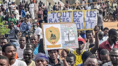 Protesters hold a banner in support of the Niger junta during a demonstration on independence day in Niamey on August 3, 2023. Security concerns built on August 3, 2023 ahead of planned protests in coup-hit Niger, with France demanding safety guarantees for foreign embassies as some Western nations reduced their diplomatic presence. (Photo by AFP) (AFP)