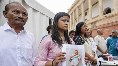 New Delhi: Dhara Shah, whose baby girl Ariha Shah has been living in a foster care in Berlin for over 20 months, at Parliament House complex during the Monsoon session in New Delhi (PTI) New Delhi: Dhara Shah, whose baby girl Ariha Shah has been living in a foster care in Berlin for over 20 months, at Parliament House complex during the Monsoon session in New Delhi (PTI)