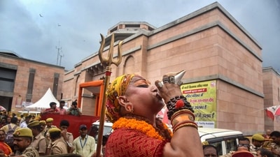 Mahamandaleshwar Hemangi Sakhi of Kinnar Akhara blows a conch after the Allahabad High Court gave the go-ahead for a scientific survey at Gyanvapi Monsque, in Varanasi, Thursday. (PTI) Mahamandaleshwar Hemangi Sakhi of Kinnar Akhara blows a conch after the Allahabad High Court gave the go-ahead for a scientific survey at Gyanvapi Monsque, in Varanasi, Thursday. (PTI)