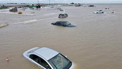 United States: Cars sit abandoned on roads as floodwaters from the Tule River inundate the area after days of heavy rain triggered by Bomb cyclone in Corcoran, California in March. The frequent cyclone, typhoons and unprecedented rain have unleashed a devastating blow to the affected communities, leaving them grappling to rebuild their lives from scratch. To add to their headache, challenges of high inflation and rising costs of living refuse to relent, making it increasingly difficult to even meet their basic needs, pushing human resource development agendas across the world years back. (Reuters)