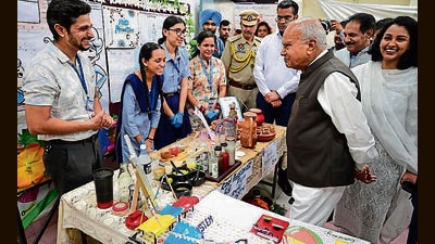 UT administrator Banwarilal Purohit interacting with students during Shiksha Samagam at Government Girls Model Senior Secondary School in Sector 18, Chandigarh. (Keshav Singh/HT)