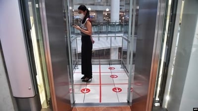 Woman seen standing inside a lift. (AFP File) Woman seen standing inside a lift. (AFP File)