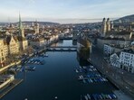 The Limmat river, the Grossmuenster and the city of Zurich are seen in early morning, Switzerland. Swiss hotels see demand jump as international tourists brush off soaring Franc 