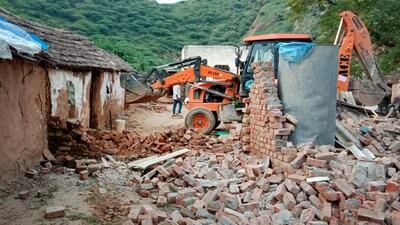 An earthmover demolishes houses at Nalhar village in Nuh, in Gurugram on Friday. (Parveen Kumar/HT) An earthmover demolishes houses at Nalhar village in Nuh, in Gurugram on Friday. (Parveen Kumar/HT)