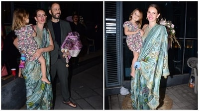 Kalki Koechlin gets captured by the paparazzi with her daughter and husband. For the occasion, she opted for a floral printed contemporary saree.&nbsp; (HT Photo)