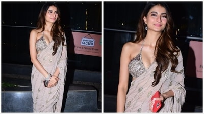Palak Tiwari wore a sheer ivory shimmery saree which she complemented with a halter-neck blouse featuring a plunging neckline.&nbsp; (HT Photo)