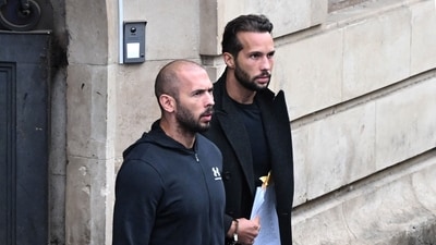 (FILES) (FILES) This file photo taken on January 10, 2023 shows British-US former professional kickboxer and controversial influencer Andrew Tate (L) and his brother Tristan Tate (R) exiting a court in Bucharest, Romania. A Romanian court on August 4, 2023 lifted a house arrest order on controversial influencer Andrew Tate and his brother who will now be placed under judicial control as they await trial on human trafficking charges. (AFP) (FILES) (FILES) This file photo taken on January 10, 2023 shows British-US former professional kickboxer and controversial influencer Andrew Tate (L) and his brother Tristan Tate (R) exiting a court in Bucharest, Romania. A Romanian court on August 4, 2023 lifted a house arrest order on controversial influencer Andrew Tate and his brother who will now be placed under judicial control as they await trial on human trafficking charges. (AFP)