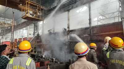 Fire fighters controlling the fire at loco workshop at Charbagh station in Lucknow on Friday morning (HT Photo)