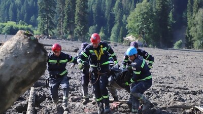 Rescue workers carry the body of a victim of a landslide, near Shovi, about 140 kilometers (85 miles) northwest of the capital Tbilisi, Georgia, Friday. (AP)