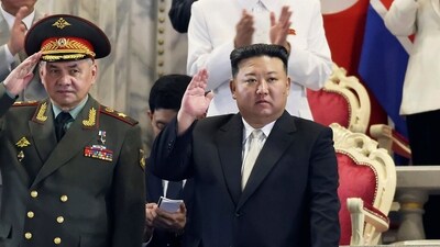 In this photo provided by the North Korean government, North Korean leader Kim Jong Un, right, and Russian Defense Minister Sergei Shoigu attend a military parade to mark the 70th anniversary of the armistice that halted fighting in the 1950-53 Korean War, on Kim Il Sung Square in Pyongyang, North Korea Thursday, July 27. (AP)