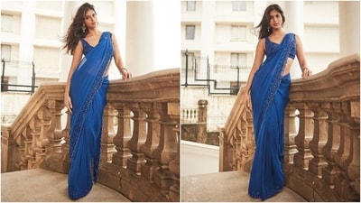 The official Instagram page of designer Arpita Mehta's label shared pictures from Suhana Khan's photoshoot in the saree with the caption, "Beauteous in Electric blue [blue heart emoji] @suhanakhan2 sizzles in our custom-made intricate mirror and cutdana hand-embroidered sari at her friend's engagement." It shows Suhana showing off the embroidered drape and looking unreal in the traditional avatar.&nbsp; (Instagram)