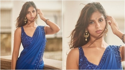 Suhana accessorised the saree with high heels and minimal jewels, including gold pearl-adorned jhumkis and a sleek bracelet. Lastly, she chose subtle eye shadow, kohl-lined eyes, mascara on the lashes, feathered brows, glossy nude lip shade, a dainty blue bindi, rouged cheekbones, and beaming highlighter for the glam picks. Side-parted and lightly tousled wavy locks gave the finishing touch. (Instagram) Suhana accessorised the saree with high heels and minimal jewels, including gold pearl-adorned jhumkis and a sleek bracelet. Lastly, she chose subtle eye shadow, kohl-lined eyes, mascara on the lashes, feathered brows, glossy nude lip shade, a dainty blue bindi, rouged cheekbones, and beaming highlighter for the glam picks. Side-parted and lightly tousled wavy locks gave the finishing touch. (Instagram)