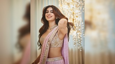 Khushi Kapoor's hairstylist gave her voluminous hair with subtle waves and a middle parting. For makeup, she opted for the soft-glam look with neutral eyes and glossy lips. (Instagram/@khushi05k)