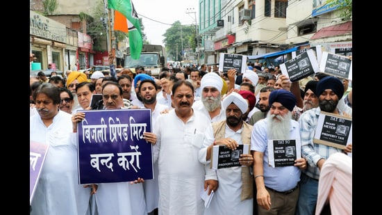 Congress supporters stage a protest against the installation of smart meter, in Jammu on Friday. (ANI)