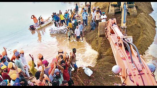 The 950 feet breach in dhussi bundh on Sutlej at Gata Mandi Kasu village in Jalandhar was finally plugged on Friday evening after 26 days. Volunteers and the authorities worked 24X7 for 18 days to plug the breach, say officials.