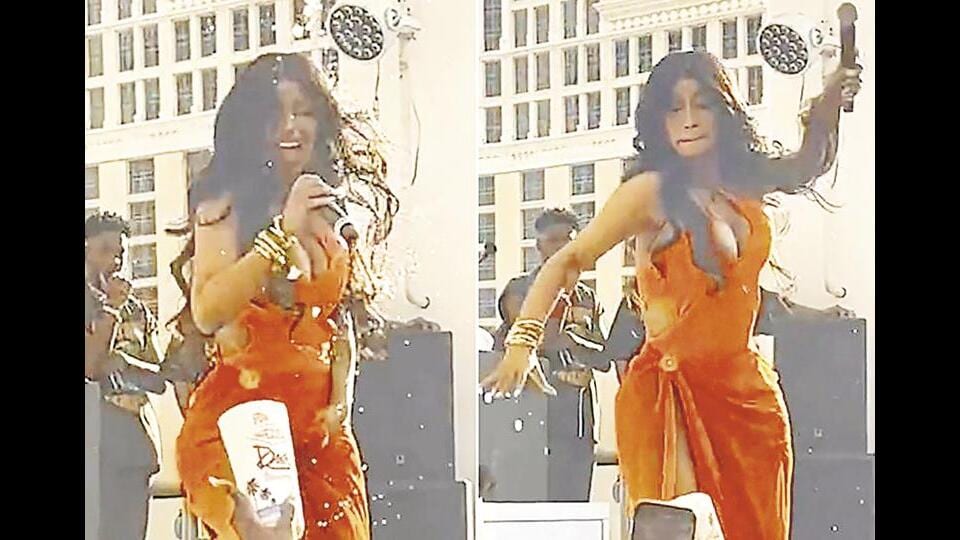 One guy threw his drink at Cardi B at a gig. She flung (above) her microphone at him in anger.