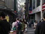 Pedestrians at the famous Myeongdong shopping district in Seoul. Pedestrians at the famous Myeongdong shopping district in Seoul.