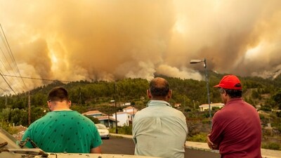 Local residents look on at a burning forest fire, near Puntagorda on the Canary Island of La Palma. The fire had coincided with a heatwave that is hitting southern Europe. Spain recorded record high temperatures in 2022 and this spring as it endures a prolonged drought. Southern Europe's vital tourism earnings at risk amid heatwaves and wildfires (AP) Local residents look on at a burning forest fire, near Puntagorda on the Canary Island of La Palma. The fire had coincided with a heatwave that is hitting southern Europe. Spain recorded record high temperatures in 2022 and this spring as it endures a prolonged drought. Southern Europe's vital tourism earnings at risk amid heatwaves and wildfires (AP)