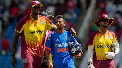 Jason Holder embraces Yuzvendra Chahal after the first T20 in Tarouba, Trinidad and Tobago (AP)