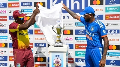 Rovman Powell (L) of West Indies and Hardik Pandya (R) of India unveil the T20I series trophy. (AFP) Rovman Powell (L) of West Indies and Hardik Pandya (R) of India unveil the T20I series trophy. (AFP)