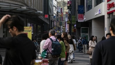 Pedestrians at the famous Myeongdong shopping district in Seoul. (Bloomberg) Pedestrians at the famous Myeongdong shopping district in Seoul. (Bloomberg)