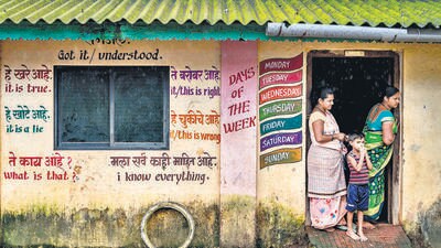 Mumbai, India - Aug. 4, 2023: To get a better understanding of the English language Ravi Kalaje, a teacher, was appointed to the Zugrewadi ZP school, near Neral, Karjat took the initiative to paint all houses in the villages with the English letter's, grammar, and mathematics. When Kalaje appointed classrooms of school were collapsing. Instead of relying on the government, he undertook the repair work himself. Many helping hands go forward. The work started from there. The classrooms were then in good condition. With the help of students and the villagers, Kalaje transformed the school and village. Now the villagers surrounding this village are renamed 'English Zugrewadi', in Maharashtra, India, on Friday, August 4, 2023. (Photo by Satish Bate/ Hindustan Times) (Hindustan Times) Mumbai, India - Aug. 4, 2023: To get a better understanding of the English language Ravi Kalaje, a teacher, was appointed to the Zugrewadi ZP school, near Neral, Karjat took the initiative to paint all houses in the villages with the English letter's, grammar, and mathematics. When Kalaje appointed classrooms of school were collapsing. Instead of relying on the government, he undertook the repair work himself. Many helping hands go forward. The work started from there. The classrooms were then in good condition. With the help of students and the villagers, Kalaje transformed the school and village. Now the villagers surrounding this village are renamed 'English Zugrewadi', in Maharashtra, India, on Friday, August 4, 2023. (Photo by Satish Bate/ Hindustan Times) (Hindustan Times)