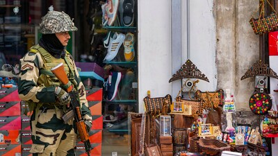 A BSF personnel stands guard on a street, a day before the fourth anniversary of the abrogation of Article 370 of the Constitution, in Srinaga. (PTI) A BSF personnel stands guard on a street, a day before the fourth anniversary of the abrogation of Article 370 of the Constitution, in Srinaga. (PTI)