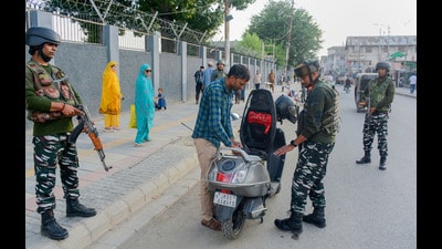 Security personnel check a scooty rider during high alert on the 4th anniversary of abrogation of Article 370 and 35A , in Srinagar on Saturday. On the fourth anniversary of the abrogation of Article 370 and 35A, PDP president and former J&K chief minister Mehbooba Mufti was put under “house arrest” today. (PTI) Security personnel check a scooty rider during high alert on the 4th anniversary of abrogation of Article 370 and 35A , in Srinagar on Saturday. On the fourth anniversary of the abrogation of Article 370 and 35A, PDP president and former J&K chief minister Mehbooba Mufti was put under “house arrest” today. (PTI)